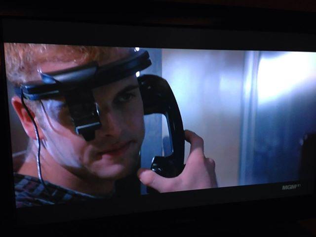 Dade Murphy using a payphone while wearing a face computer in Hackers (1995)