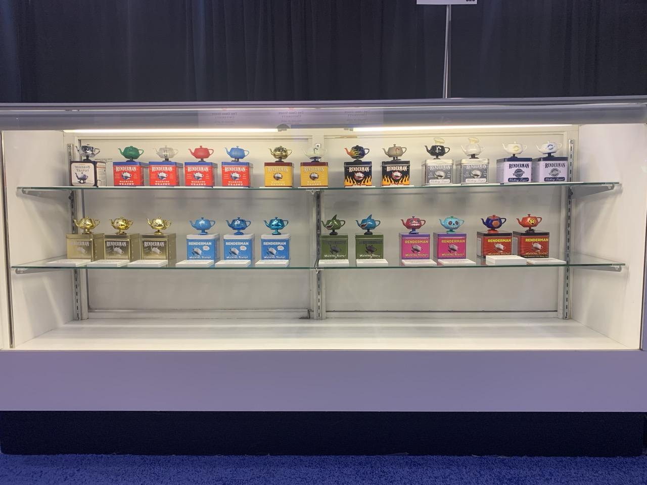 The left case of walking teapots at Pixar's booth at SIGGRAPH.