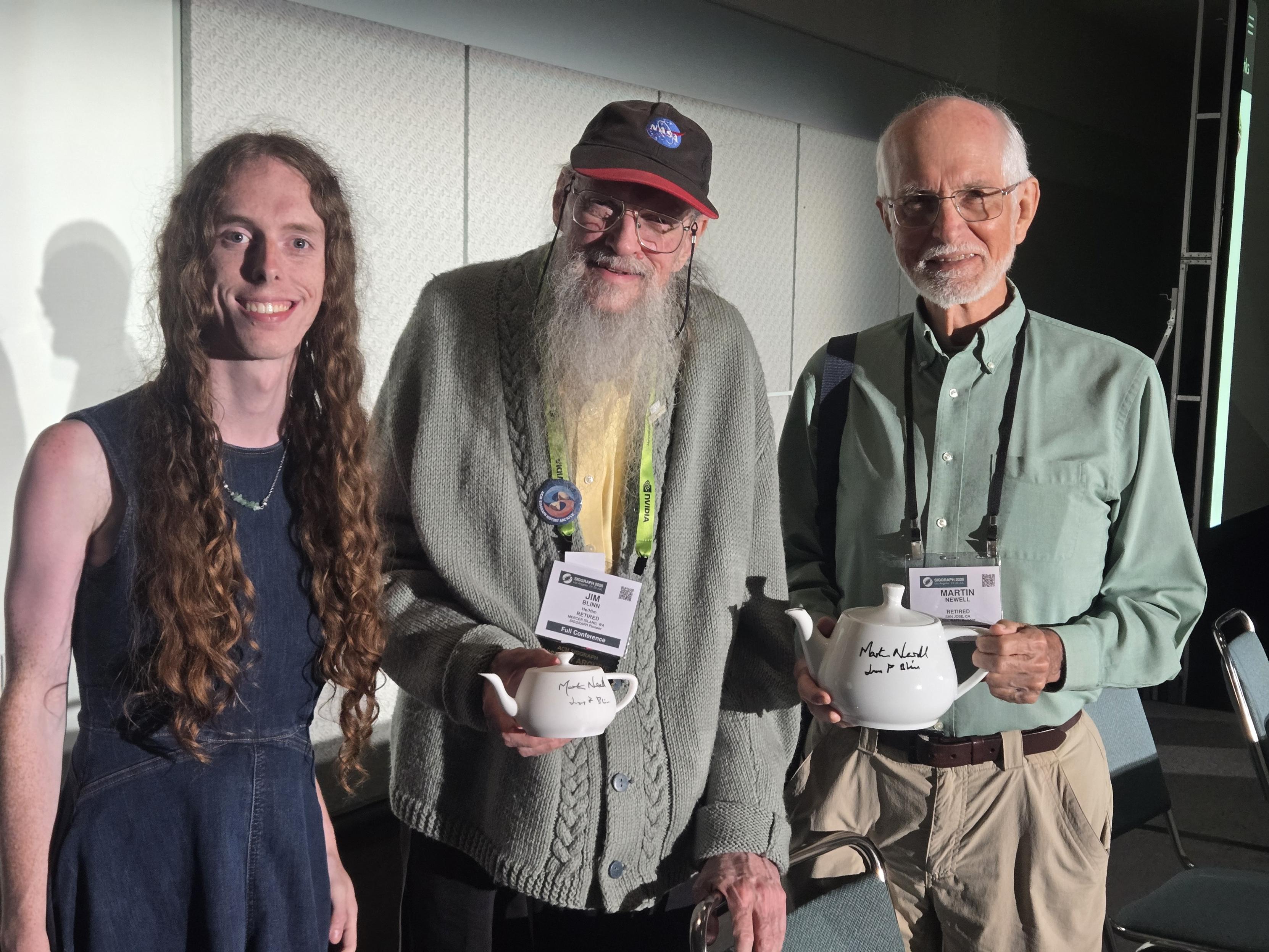 Thalia Archibald, Jim Blinn, and Martin Newell just after their panel on the Utah teapot, holding my teapots.
